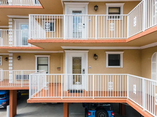 a bedroom with a bed and painting on the wall