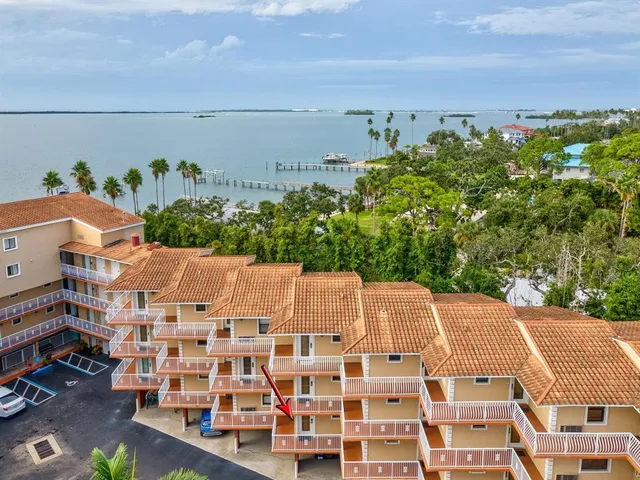 a view of a swimming pool with an outdoor seating
