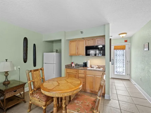 a sign that is sitting on a wooden wall