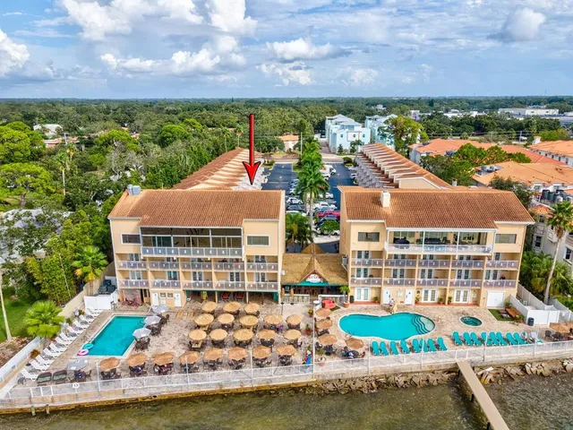 an aerial view of a house with outdoor space