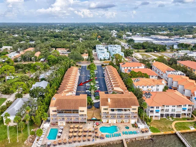 a view of a garden with a building in the background