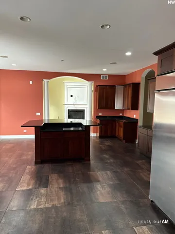 a living room with hard wood floors and furniture