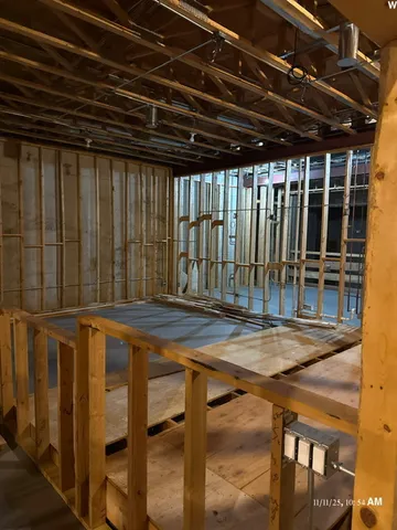 a view of a backyard with table and chairs