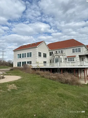 a view of house with outdoor space and swimming pool