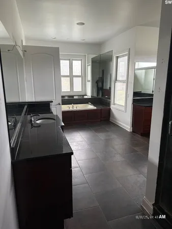 a kitchen with a sink and a refrigerator