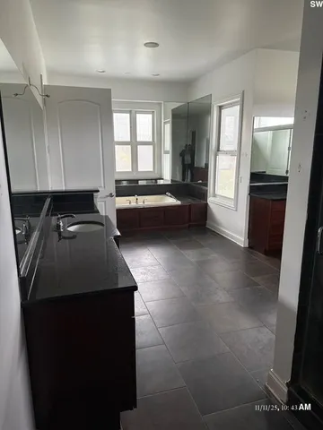 a kitchen with a sink and a refrigerator