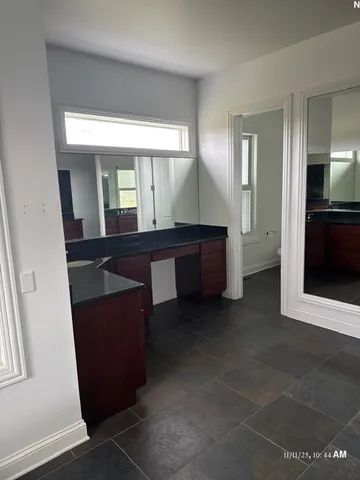 a view of a large mirror and a sink