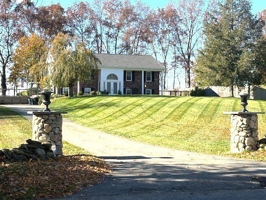 71 Old Amesbury Line Road Haverhill, MA 01830 - Photo 1 of 40 a front view of house with yard and trees