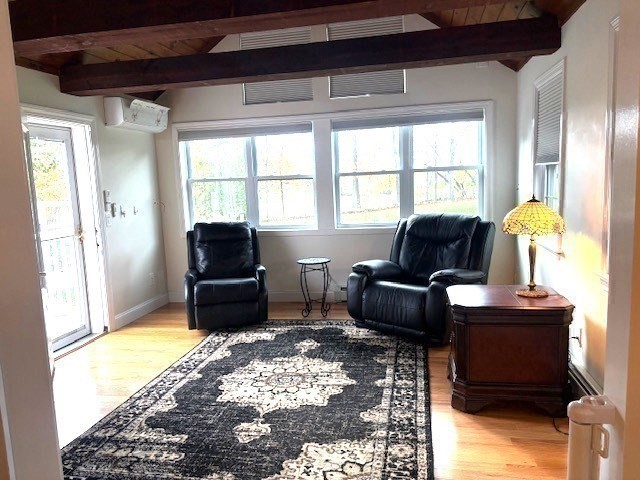 71 Old Amesbury Line Road Haverhill, MA 01830 - Photo 13 of 40 a living room with furniture and a flat screen tv