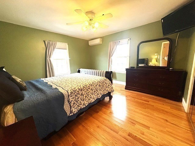 71 Old Amesbury Line Road Haverhill, MA 01830 - Photo 15 of 40 a bedroom with a bed lamps and mirror