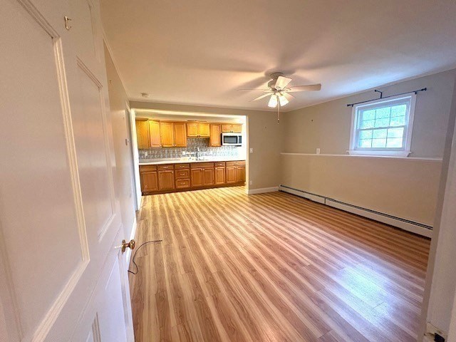 71 Old Amesbury Line Road Haverhill, MA 01830 - Photo 27 of 40 a view of empty room with wooden floor and fan