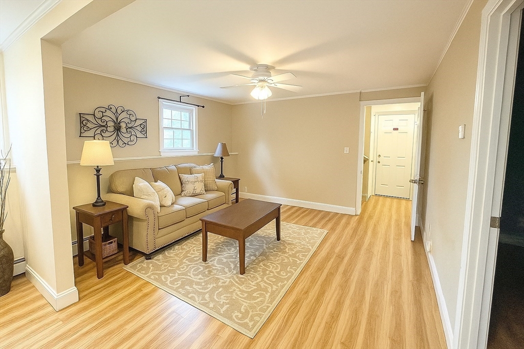 71 Old Amesbury Line Road Haverhill, MA 01830 - Photo 28 of 40 a living room with a couch and wooden floor