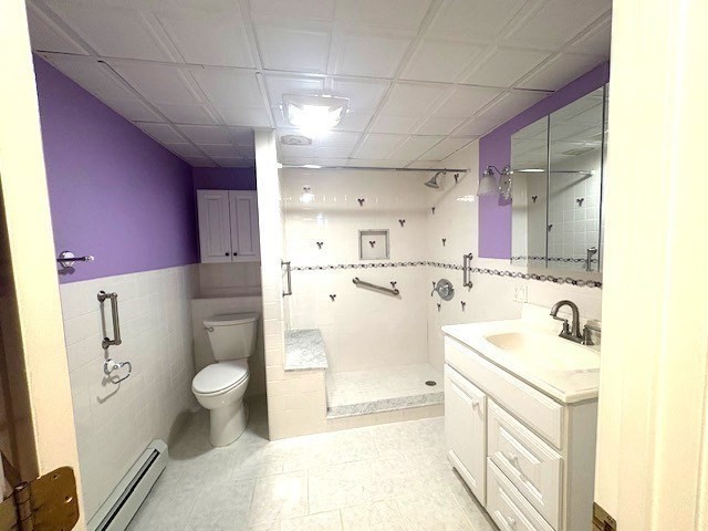 71 Old Amesbury Line Road Haverhill, MA 01830 - Photo 33 of 40 a bathroom with a sink toilet a mirror and shower