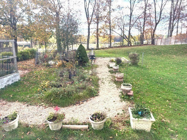 71 Old Amesbury Line Road Haverhill, MA 01830 - Photo 39 of 40 a backyard of a house with lots of green space