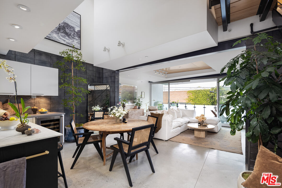 351 Sunset Avenue, Unit 5 Venice, CA 90291 - Photo 1 of 29 a dining room with furniture and a large window