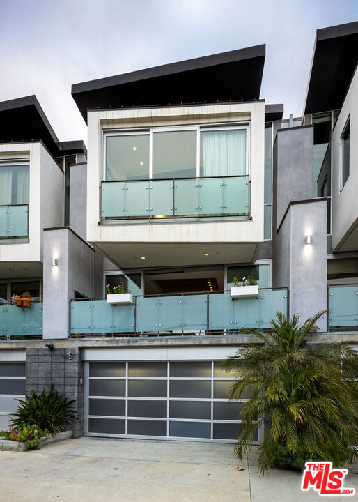 351 Sunset Avenue, Unit 5 Venice, CA 90291 - Photo 2 of 29 a front view of a house with a garage