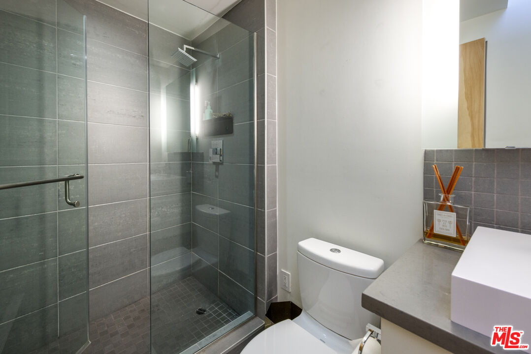 351 Sunset Avenue, Unit 5 Venice, CA 90291 - Photo 22 of 29 a white toilet sitting next to a bathroom sink