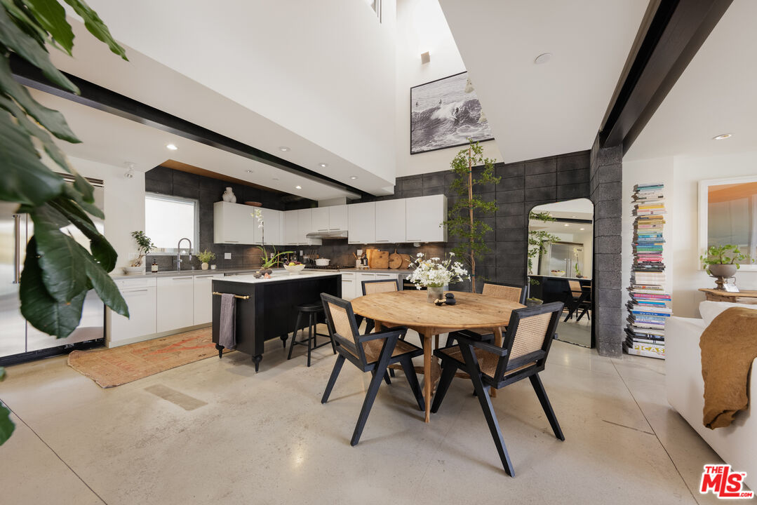 351 Sunset Avenue, Unit 5 Venice, CA 90291 - Photo 6 of 29 a view of a dining room with furniture and a chandelier