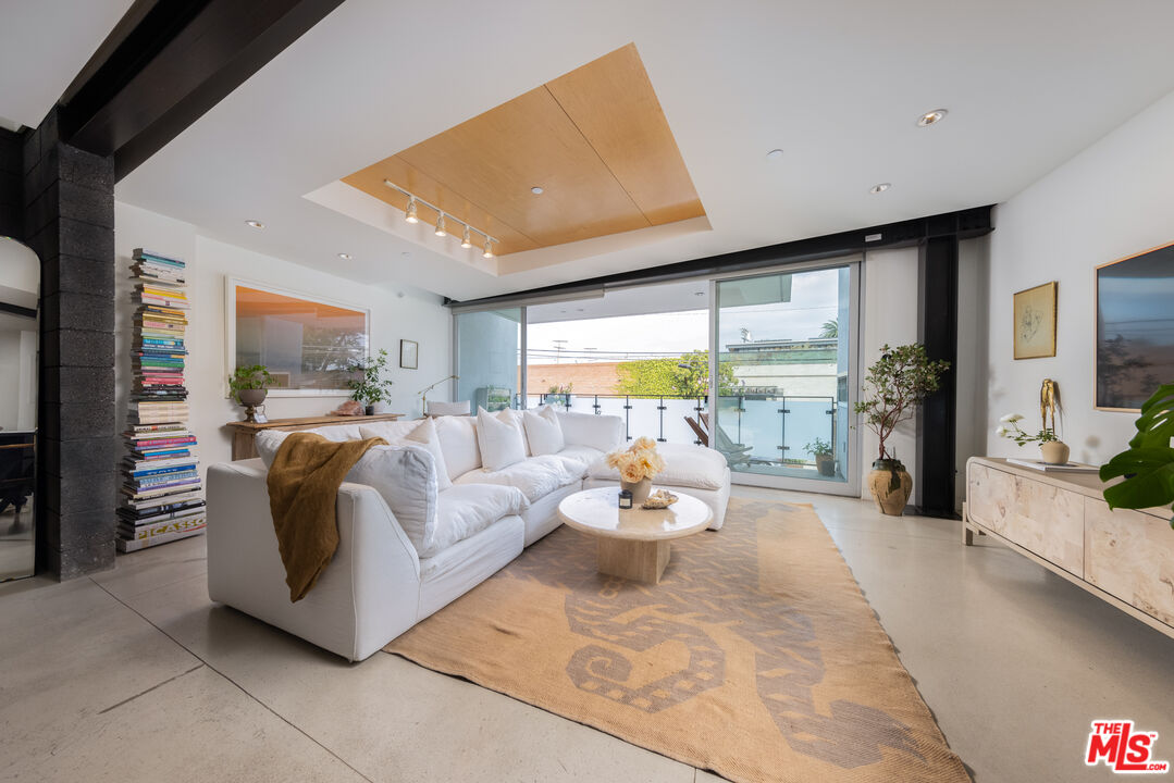 351 Sunset Avenue, Unit 5 Venice, CA 90291 - Photo 7 of 29 a living room with furniture and a large window