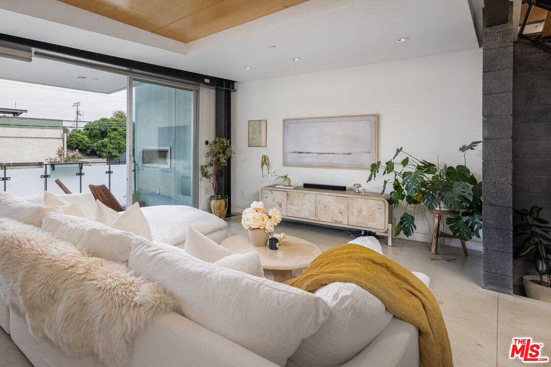 351 Sunset Avenue, Unit 5 Venice, CA 90291 - Photo 8 of 29 a living room with furniture and a large window
