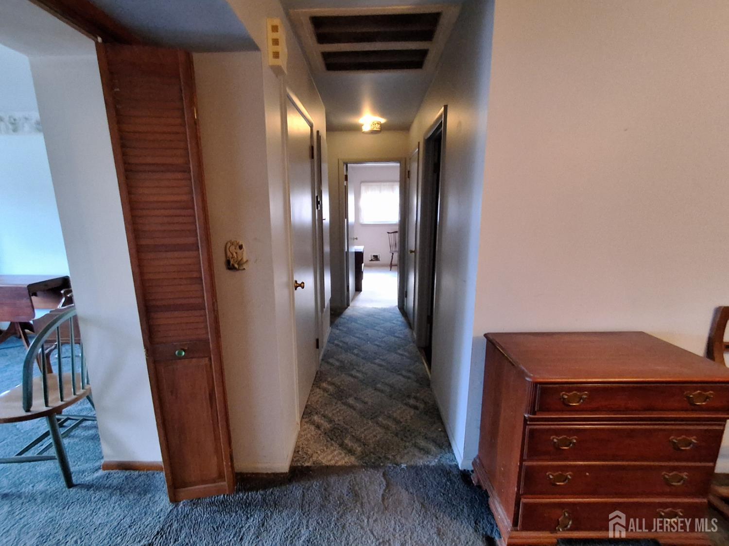 6 Nicholas Court Milltown, NJ 08850 - Photo 14 of 30 a view of a hallway with wooden floor and stairs