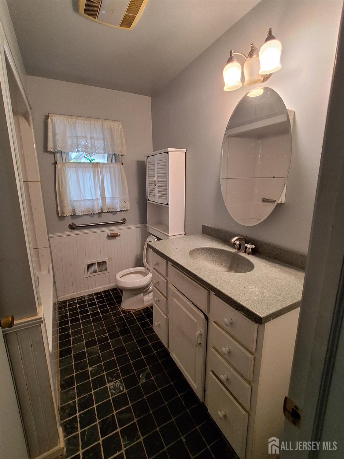 6 Nicholas Court Milltown, NJ 08850 - Photo 15 of 30 a bathroom with a sink toilet and a mirror