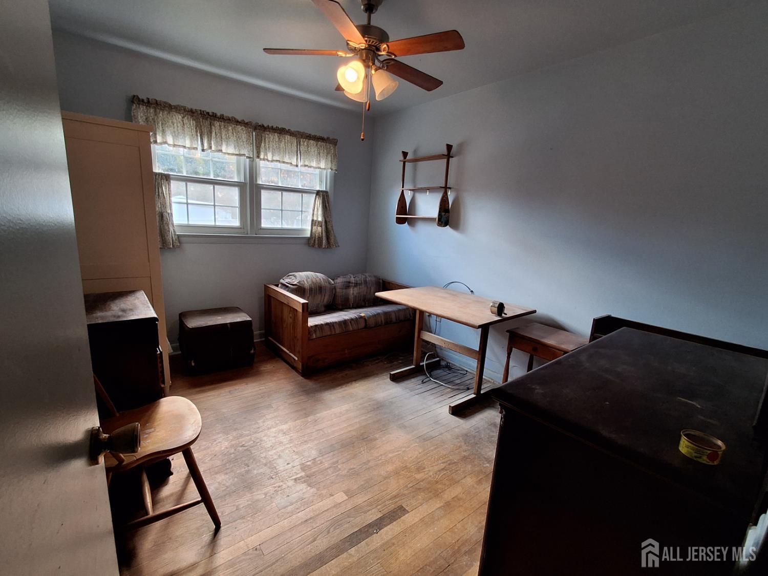 6 Nicholas Court Milltown, NJ 08850 - Photo 19 of 30 a living room with furniture and a window
