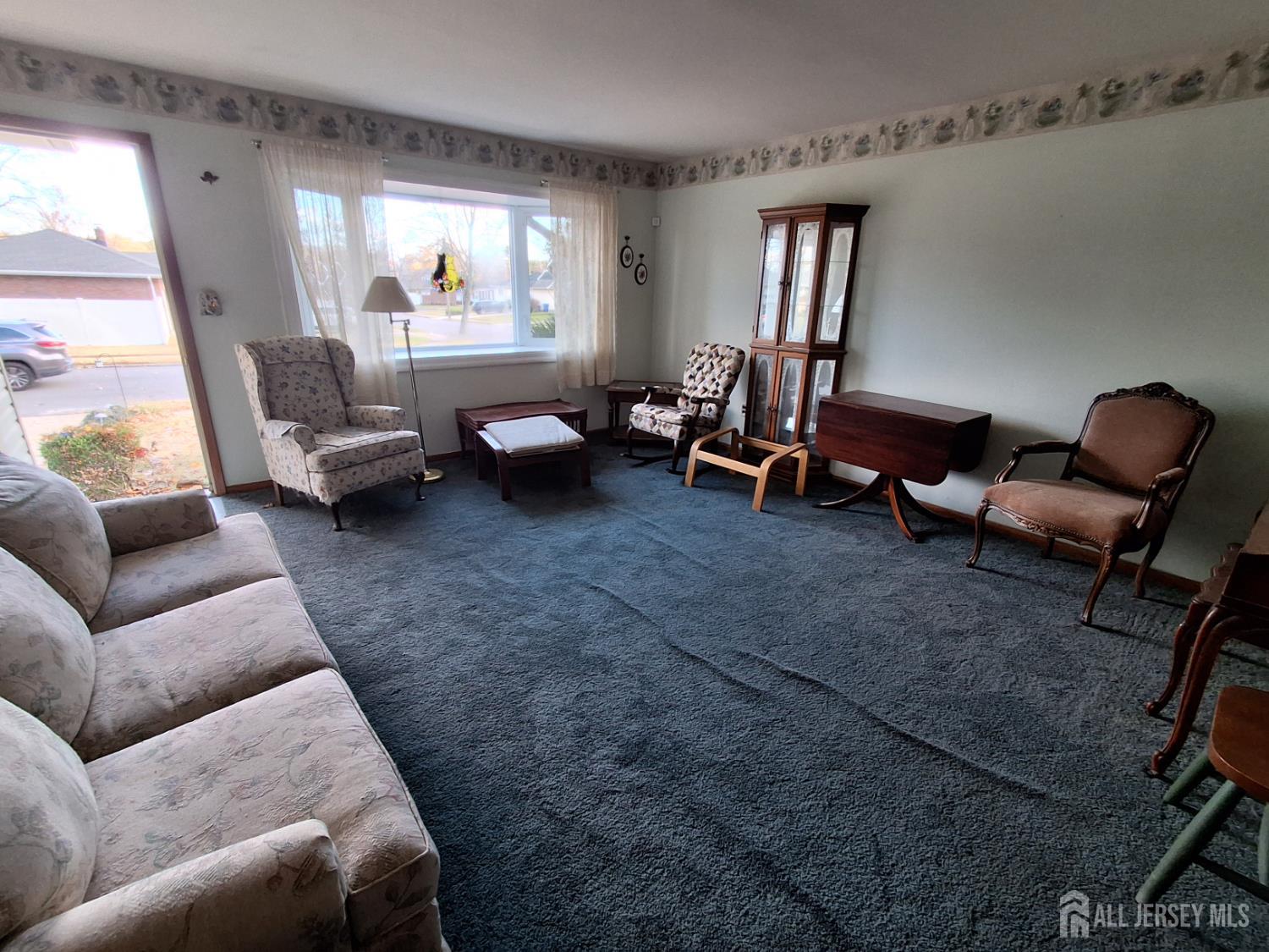 6 Nicholas Court Milltown, NJ 08850 - Photo 6 of 30 a living room with furniture and a window