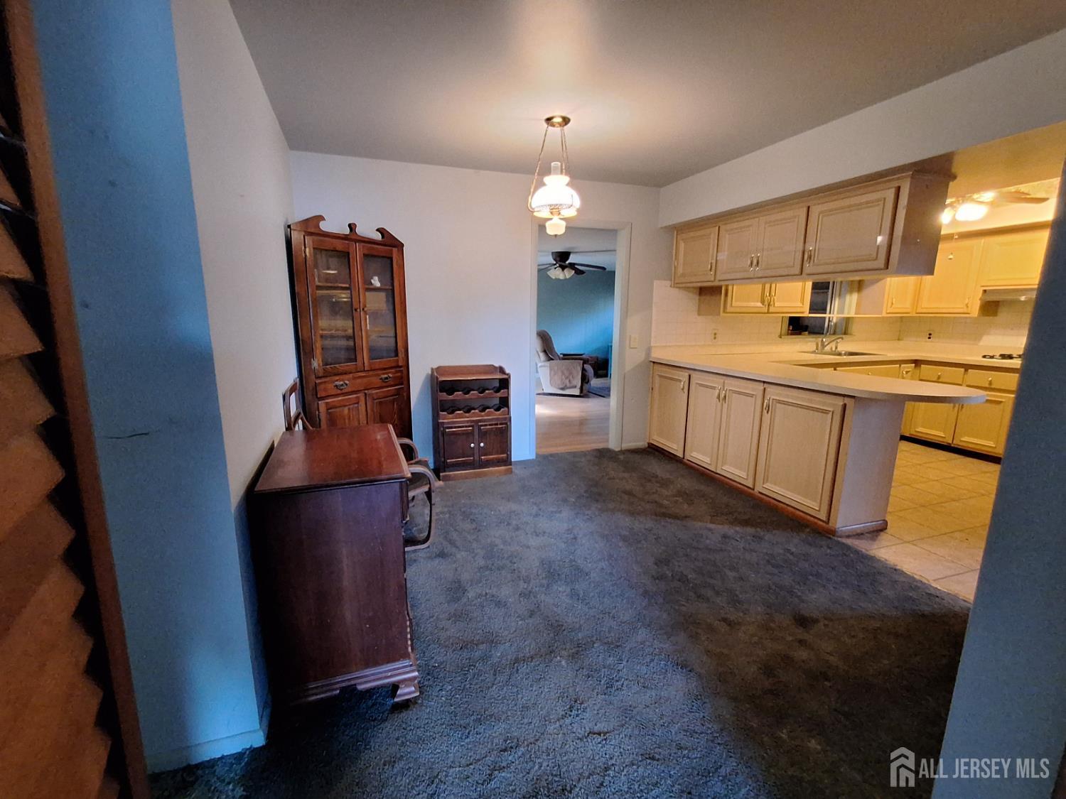 6 Nicholas Court Milltown, NJ 08850 - Photo 7 of 30 a kitchen with stainless steel appliances granite countertop a refrigerator a sink dishwasher a stove and a dining table with wooden floor