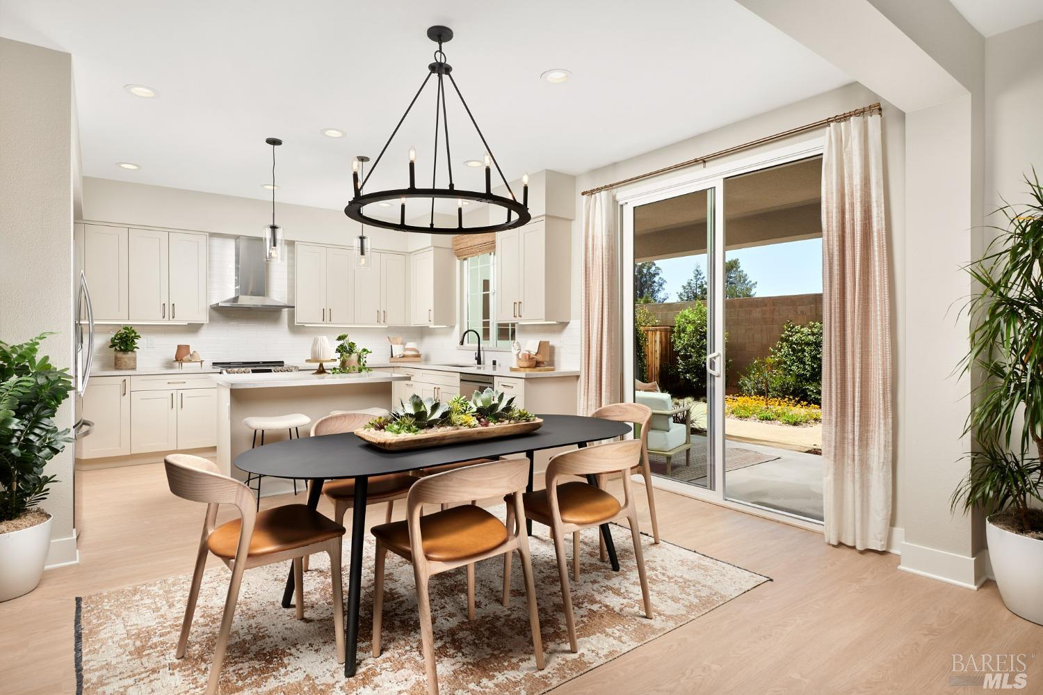 2786 Sassy Street Santa Rosa, CA 95407 - Photo 2 of 5 a dining room with stainless steel appliances granite countertop a table and chairs in the kitchen