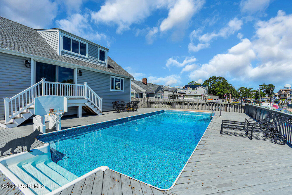 1648 Center Street Point Pleasant, NJ 08742 - Photo 17 of 26 a view of a patio with chairs and a table