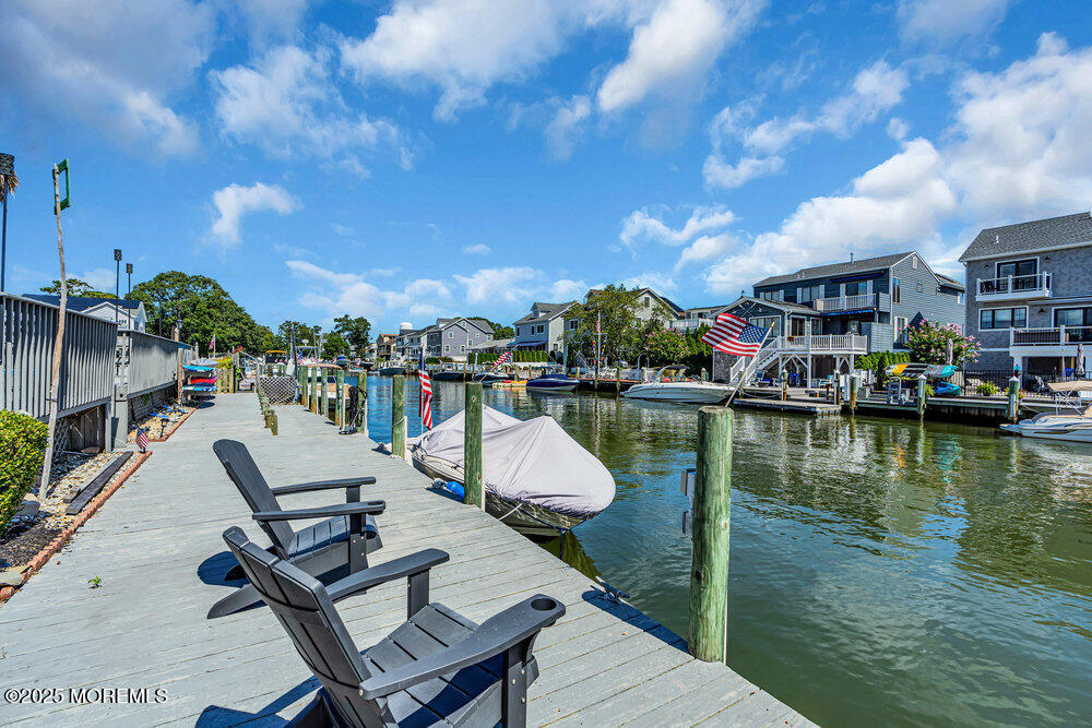 1648 Center Street Point Pleasant, NJ 08742 - Photo 21 of 26 a view of swimming pool with outdoor seating and lake view