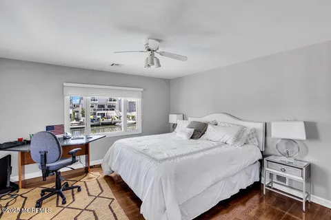 a bedroom with a bed and a desk