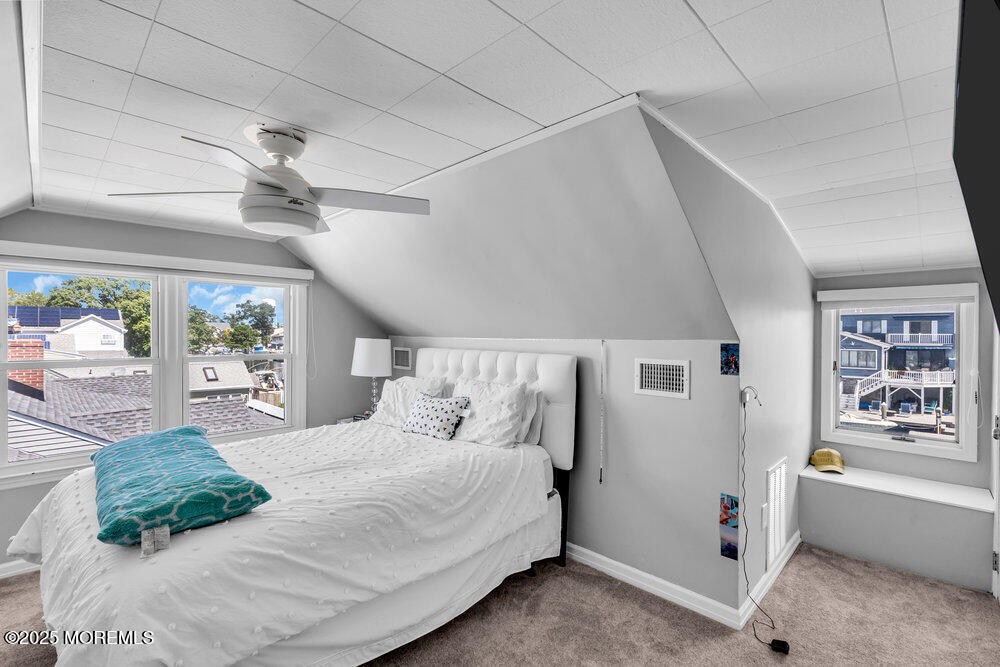 1648 Center Street Point Pleasant, NJ 08742 - Photo 10 of 26 a bedroom with a large bed and a window