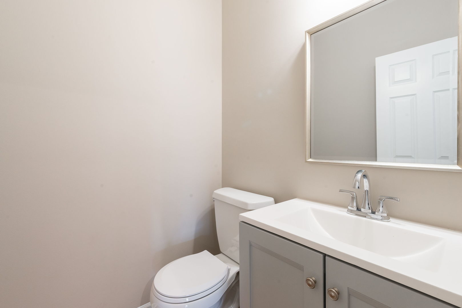2147 Fargo Boulevard Geneva, IL 60134 - Photo 11 of 27 a bathroom with a sink a toilet and mirror