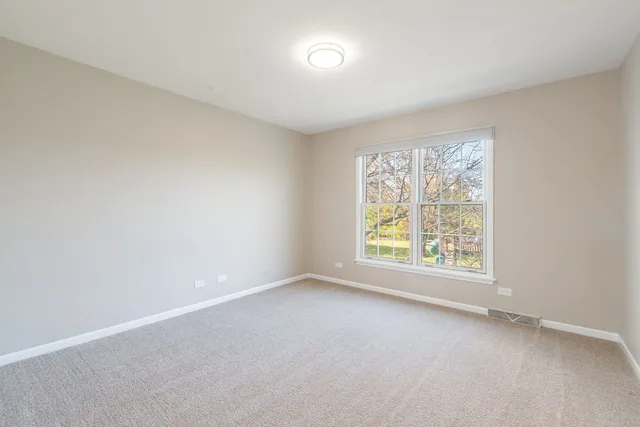a bathroom with a double vanity sink toilet mirror and bathtub