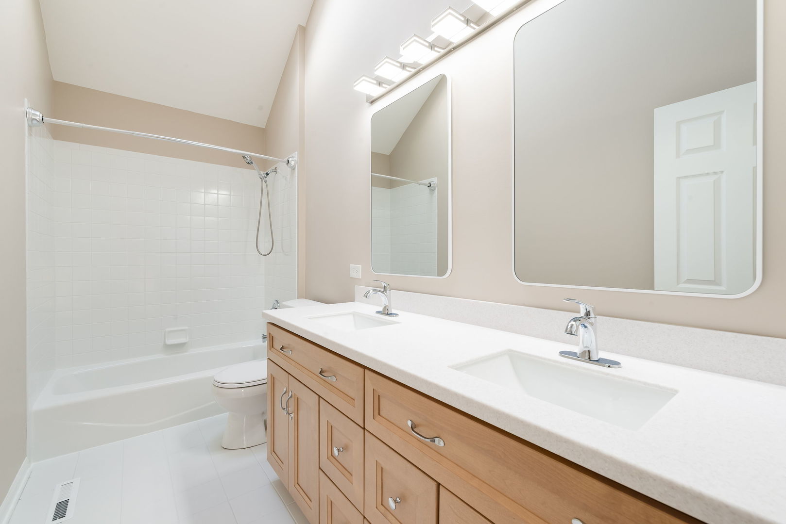 2147 Fargo Boulevard Geneva, IL 60134 - Photo 17 of 27 a bathroom with a double vanity sink toilet mirror and bathtub