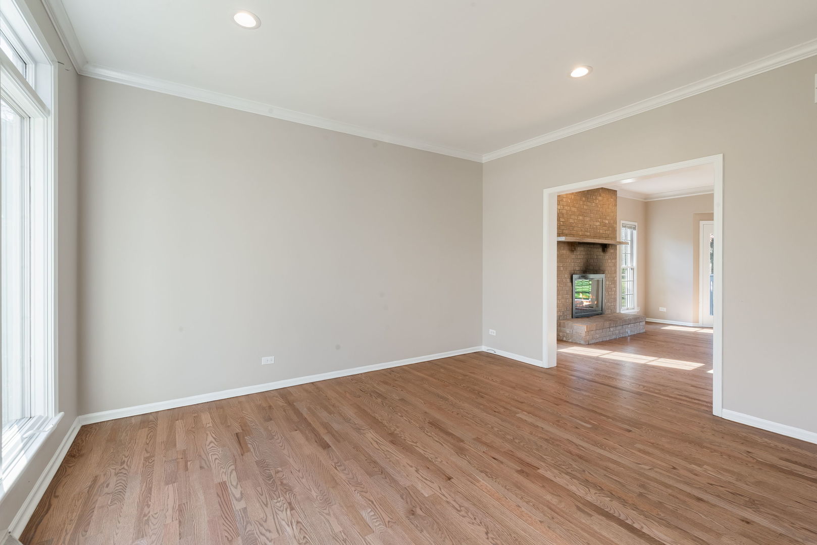 2147 Fargo Boulevard Geneva, IL 60134 - Photo 5 of 27 wooden floor in an empty room with a window