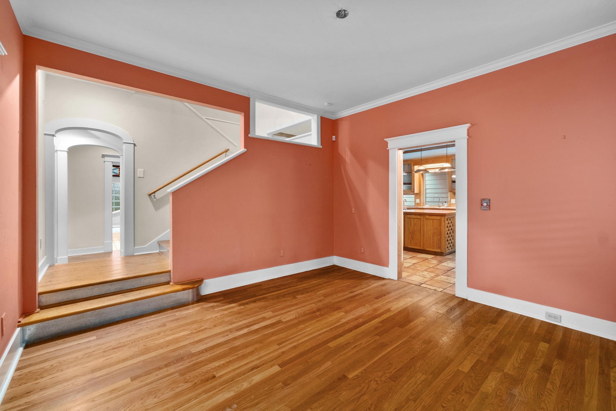 1502 Murray Lane Austin, TX 78703 - Photo 12 of 33 a view of an empty room with wooden floor and a window