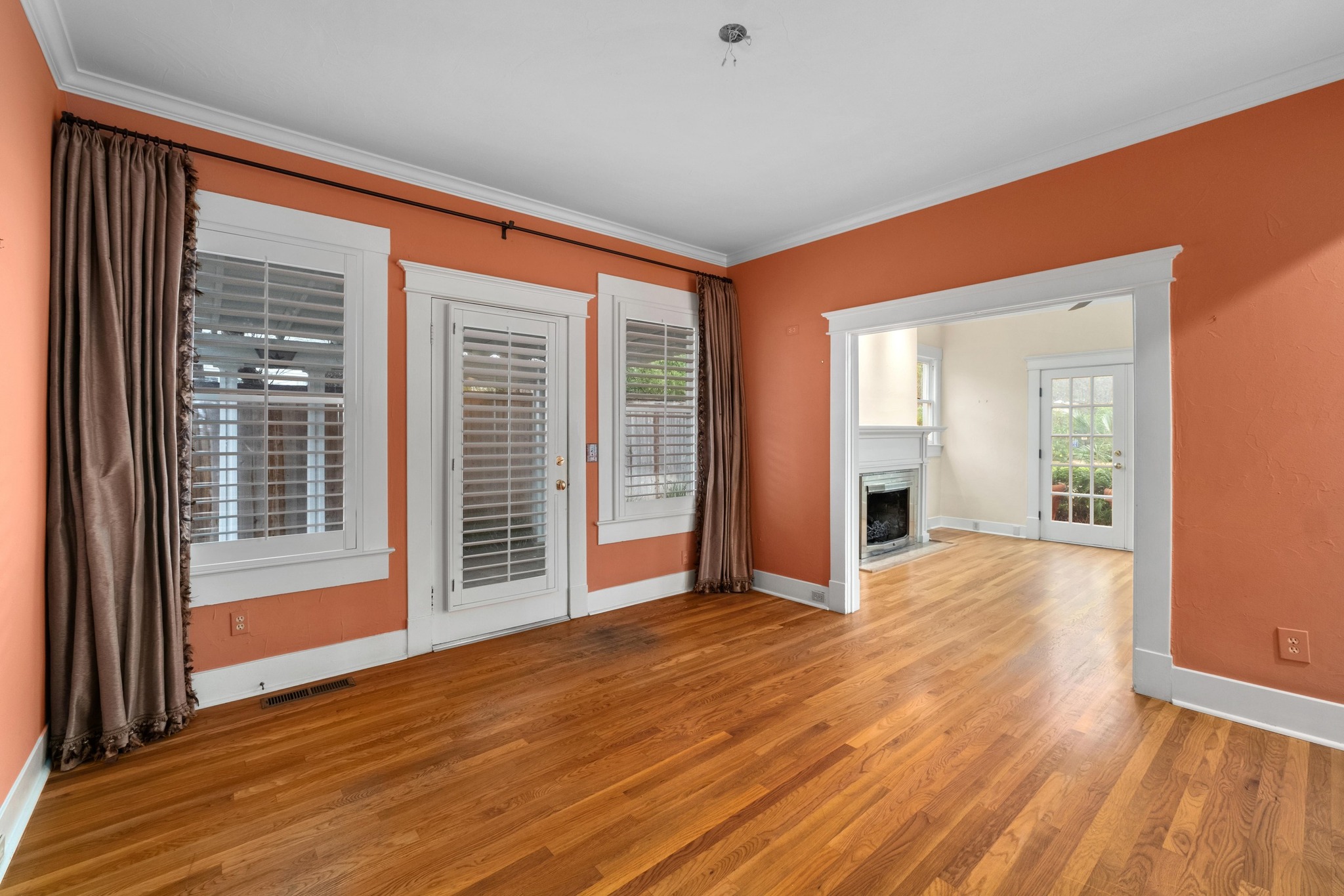 1502 Murray Lane Austin, TX 78703 - Photo 13 of 33 a view of an empty room with wooden floor and a window