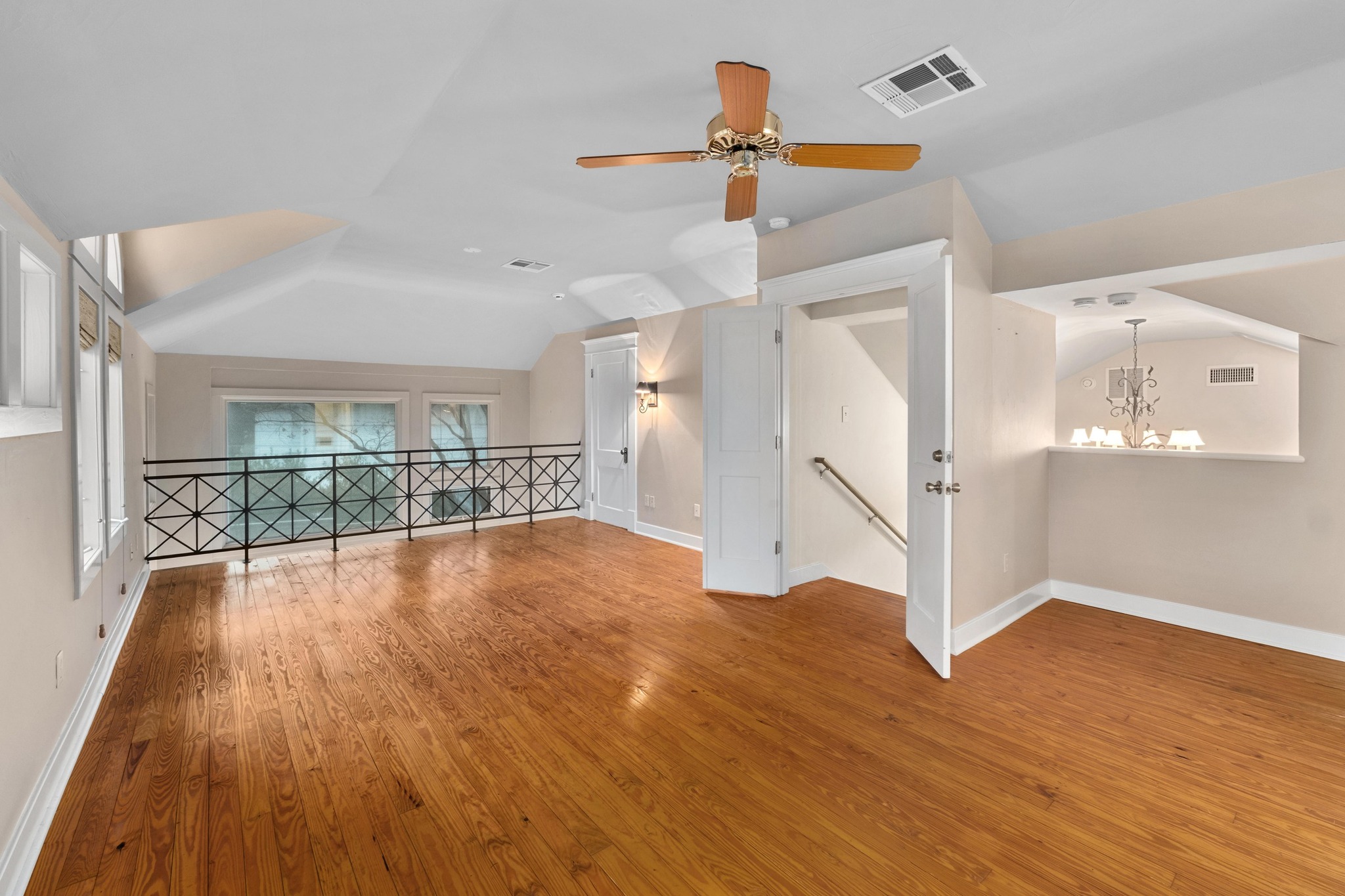 1502 Murray Lane Austin, TX 78703 - Photo 15 of 33 a view of empty room with wooden floor and fan