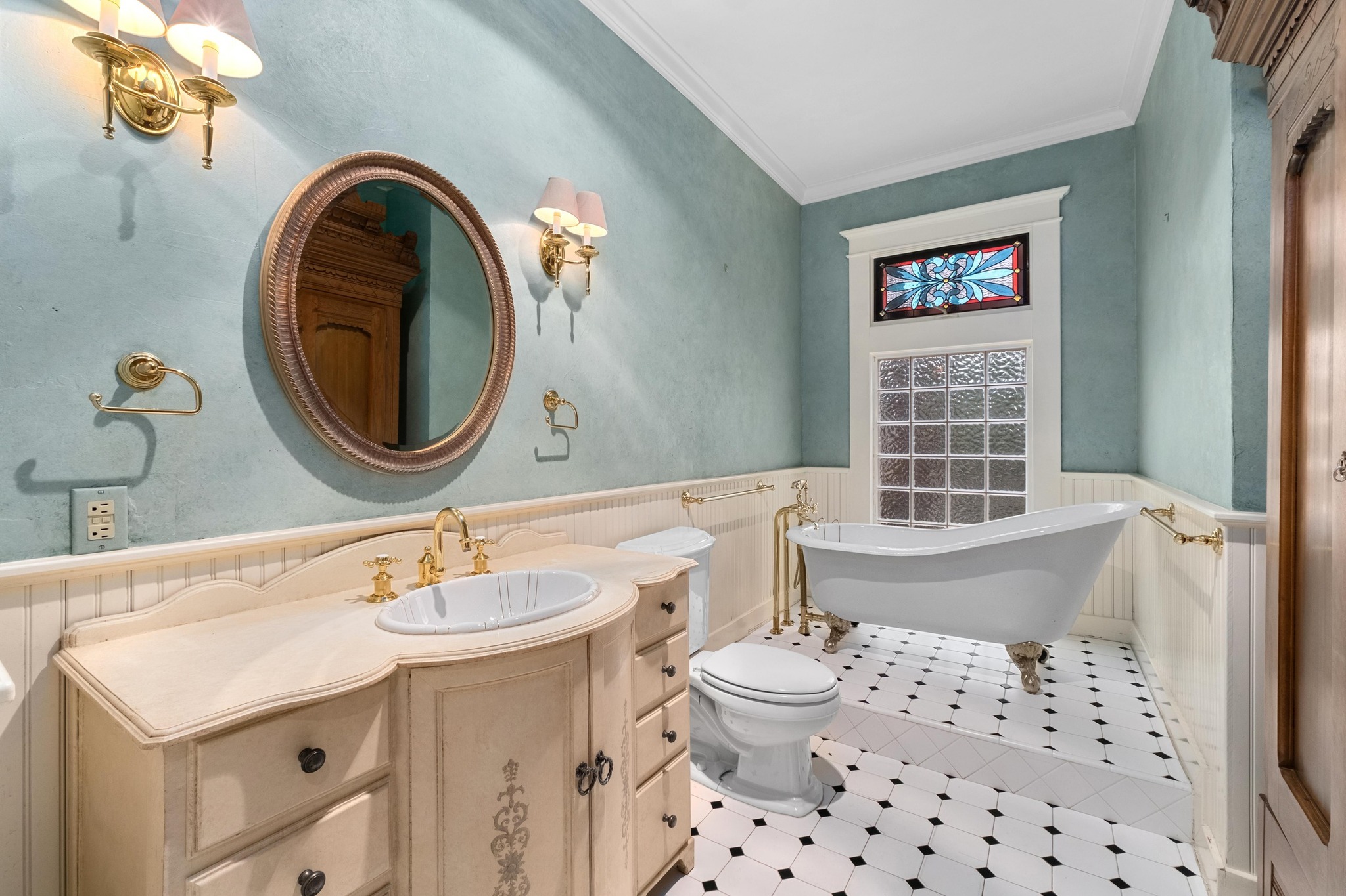 1502 Murray Lane Austin, TX 78703 - Photo 19 of 33 a bathroom with a sink a toilet and a mirror