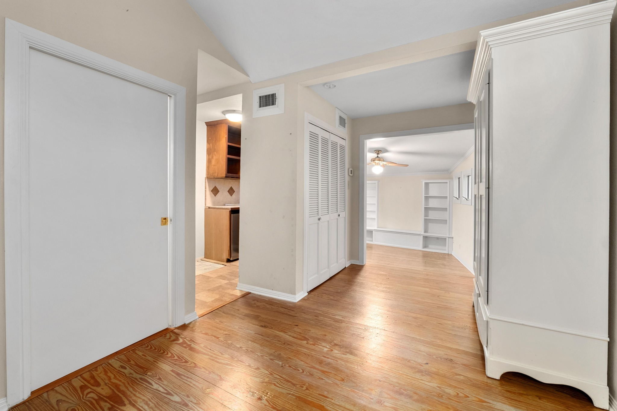 1502 Murray Lane Austin, TX 78703 - Photo 24 of 33 a view of a hallway with wooden floor and closet