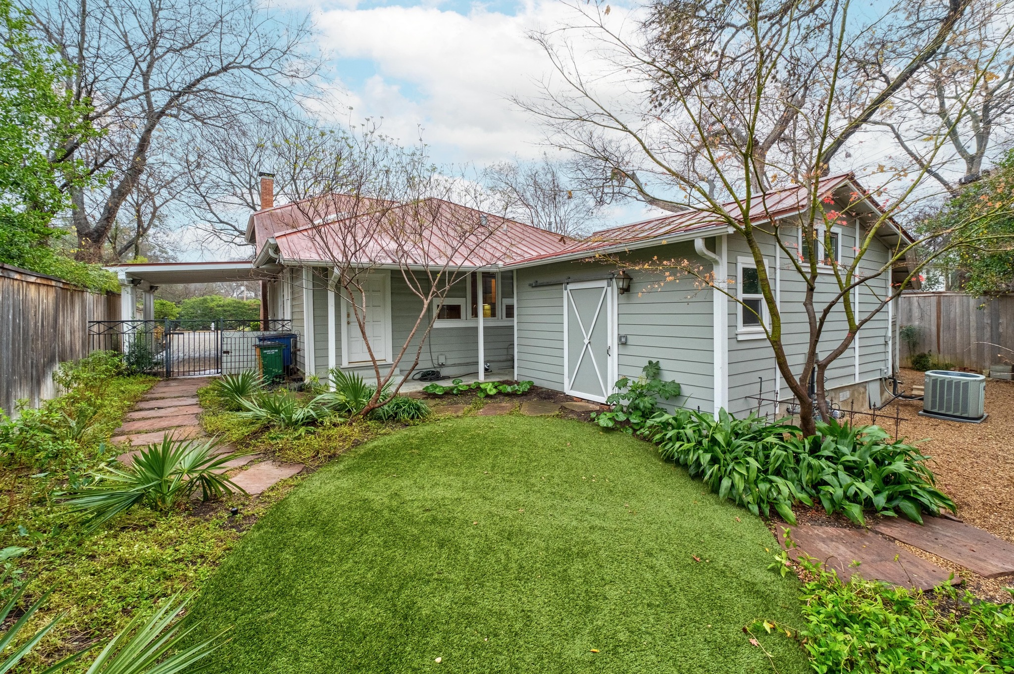 1502 Murray Lane Austin, TX 78703 - Photo 27 of 33 a front view of a house with garden
