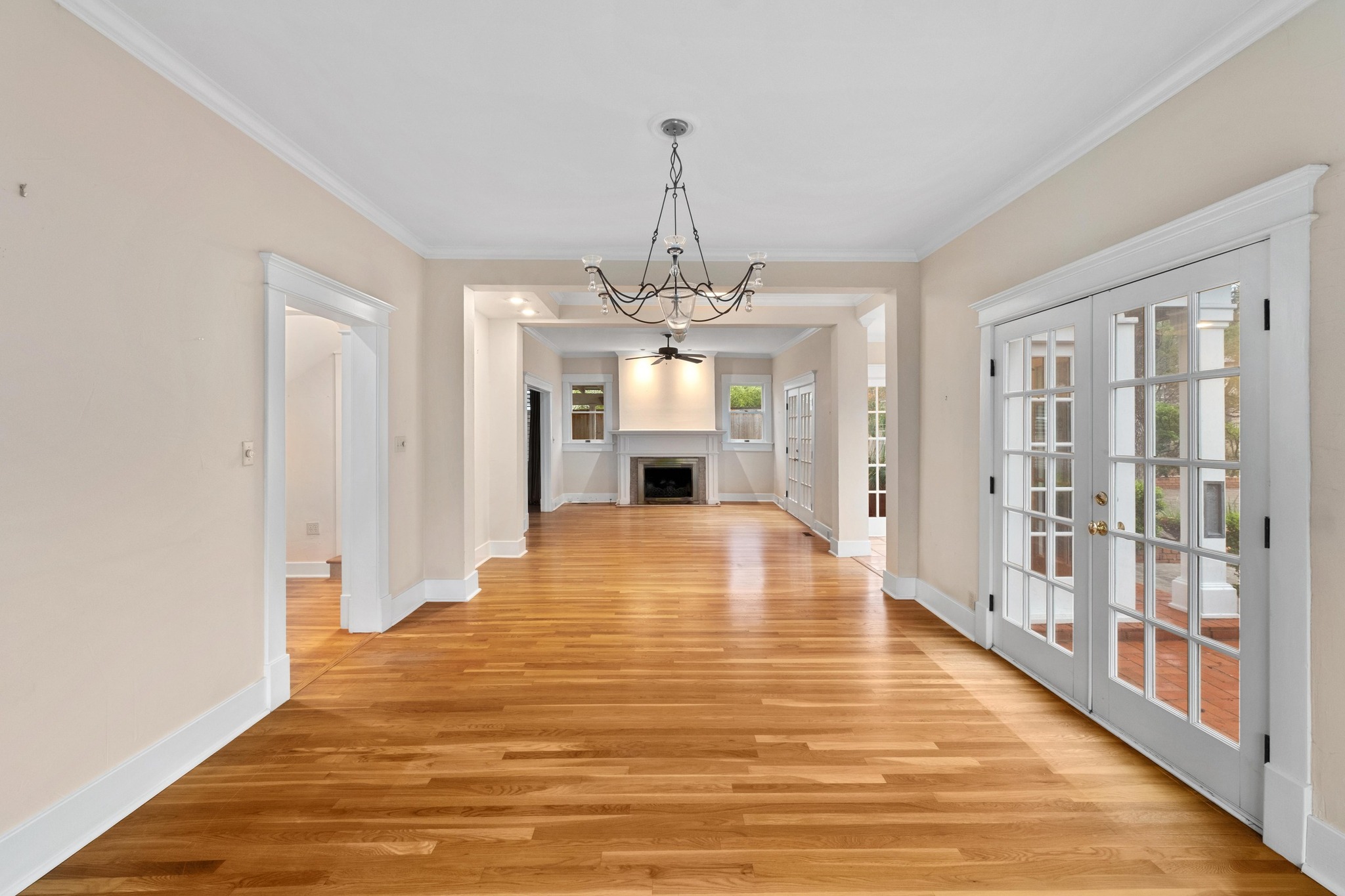 1502 Murray Lane Austin, TX 78703 - Photo 4 of 33 a large room with wooden floor fireplace and windows