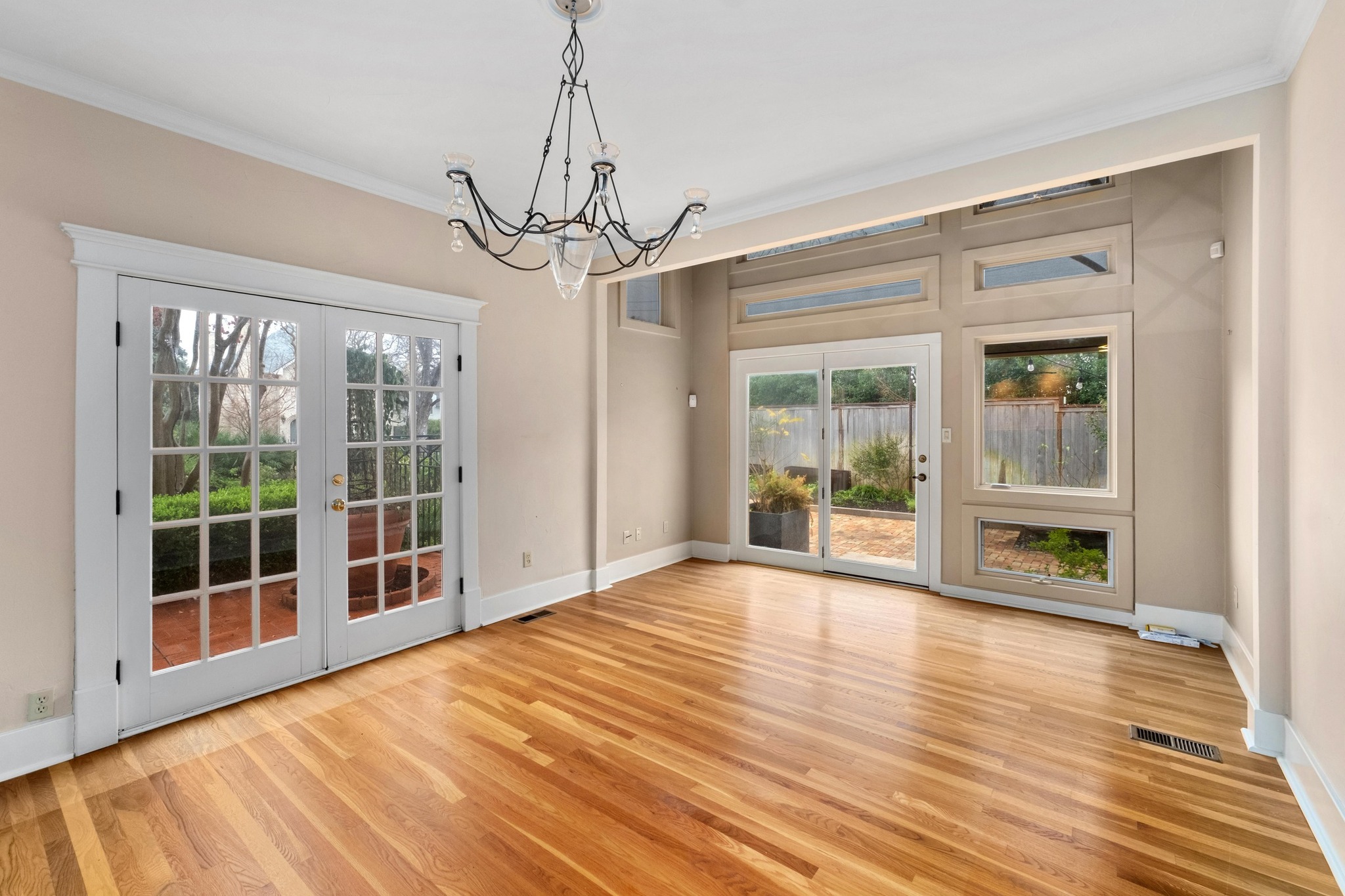 1502 Murray Lane Austin, TX 78703 - Photo 7 of 33 a view of an empty room with wooden floor and a window