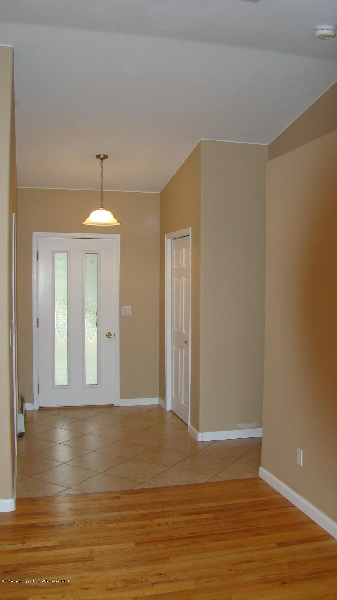 1462 Graham Court Rifle, CO 81650 - Photo 5 of 18 a view of a livingroom with wooden floor and chandelier