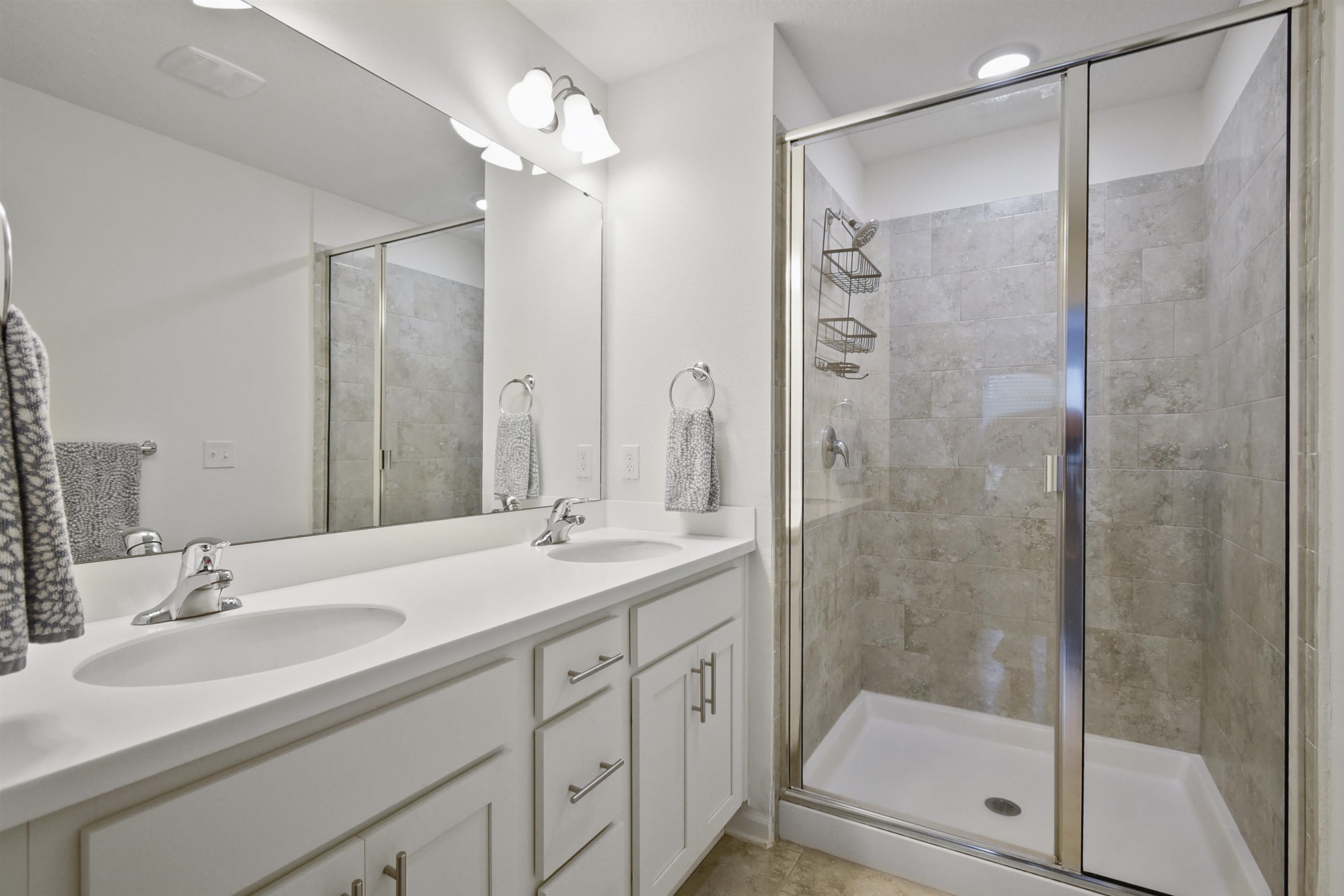 105 Ridge Lake Road St. Augustine, FL 32086 - Photo 21 of 34 a bathroom with a shower sink vanity granite and mirror
