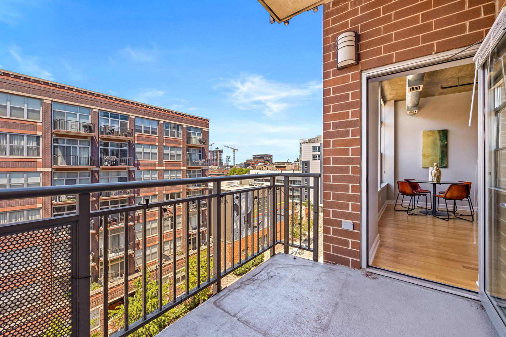 111 South Morgan Street, Unit 707 Chicago, IL 60607 - Photo 11 of 22 a view of a balcony with an outdoor seating
