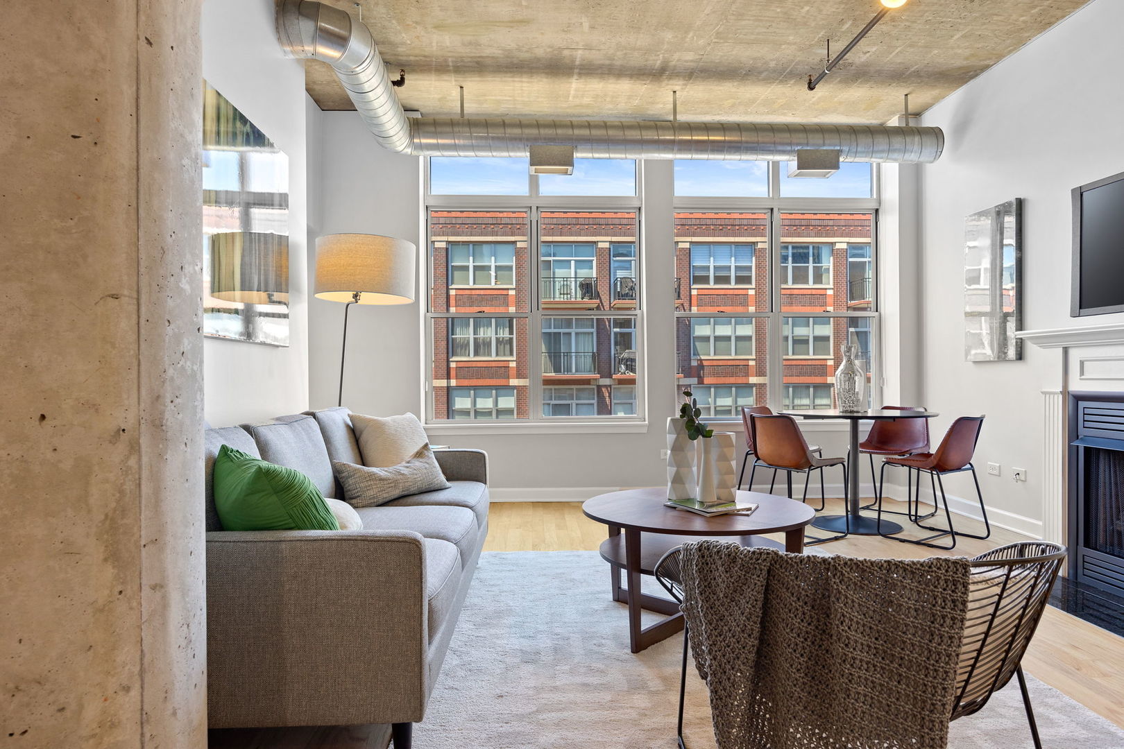 111 South Morgan Street, Unit 707 Chicago, IL 60607 - Photo 3 of 22 a dining room with furniture a chandelier and glass door